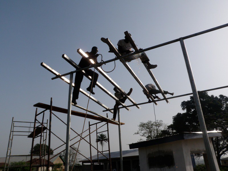 Team assembling a steel communications structure